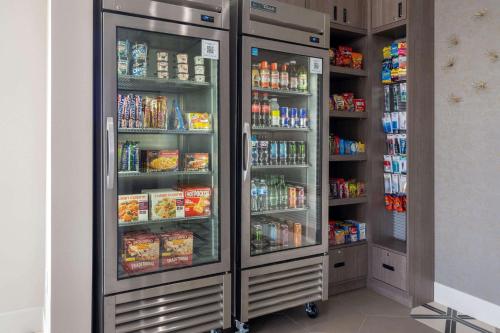 a refrigerator filled with lots of food and drinks at Ramada by Wyndham Modesto Yosemite Area in Modesto