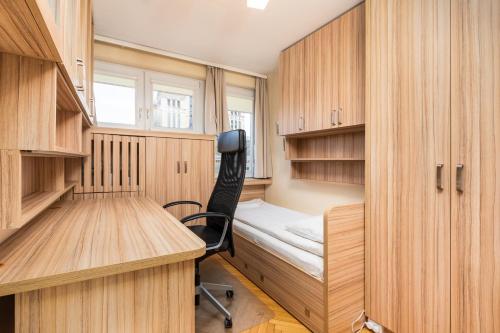 a small room with a desk and a chair in it at Apartament Emilii Plater by Your Freedom in Warsaw