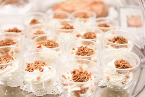 a tray of mini dessert cups with nuts in them at Executive Inn Boutique Hotel in Brindisi