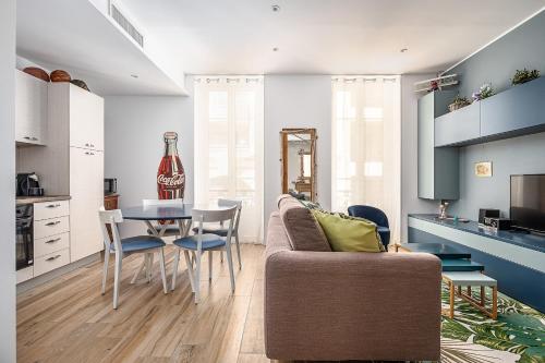 a living room with a couch and a table at Classbnb - 2 comfortable apartments in Monte Carlo in Beausoleil