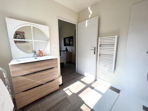a bathroom with a sink and a mirror at La Chambre Cézanne in Aix-en-Provence