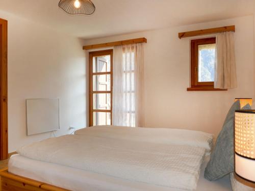 Katil atau katil-katil dalam bilik di Holiday Home Simano by Interhome