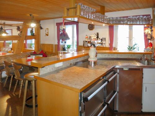 a kitchen with a sink and a counter top at Holiday Home Hexenstüble by Interhome in Simonswald
