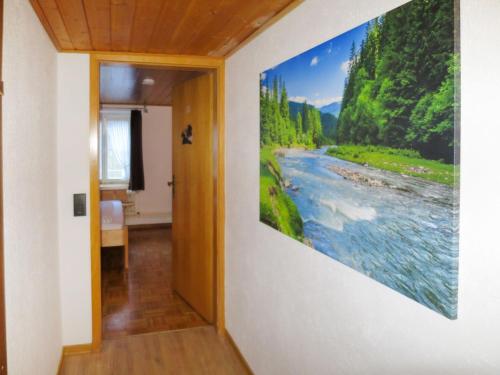 a painting of a river on a wall at Holiday Home Hexenstüble by Interhome in Simonswald