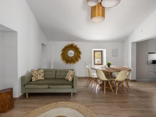 a living room with a couch and a table at Holiday Home Quinta de Santa Emilia 3 by Interhome in São Martinho