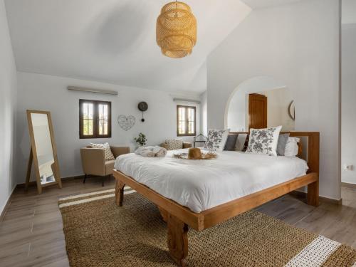a bedroom with a large bed in a room at Holiday Home Quinta de Santa Emilia 3 by Interhome in São Martinho