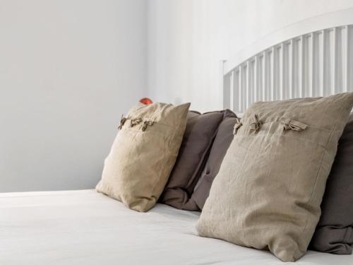 a group of pillows sitting on a bed at Holiday Home Quinta de Santa Emilia 1 by Interhome in São Martinho