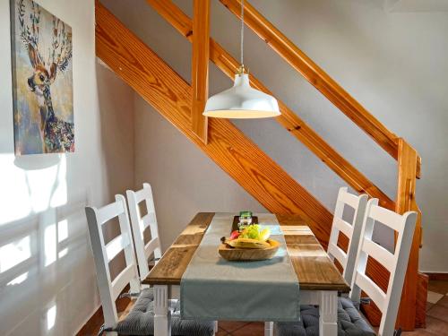 a dining room with a wooden table and chairs at Apartment Gotland by Interhome in Dargun