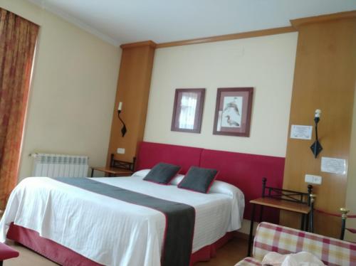 Letto o letti in una camera di Área de Servicio El Cruce