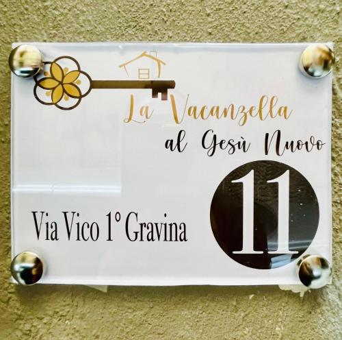 a sign on a wall that says la venezuela at green forest mercy at La Vacanzella al Gesu' Nuovo in Naples