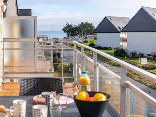 a bowl of fruit on a table on a balcony at Apartment Le Yacht Club by Interhome in Quiberon