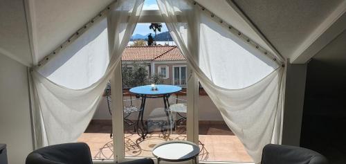 a view of a balcony with a table and chairs at A&B Home Hotel in Göcek