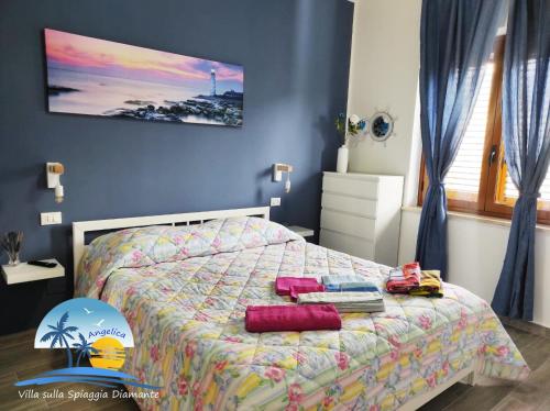 Voodi või voodid majutusasutuse Villa sulla Spiaggia Diamante toas