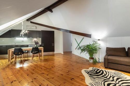 a living room with a table and a couch at Downtown - Chiado & Me 2 in Lisbon