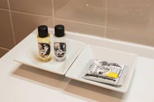 two bottles of mouthwash and toothpaste sitting on a bathroom counter at Downtown - Chiado & Me 2 in Lisbon