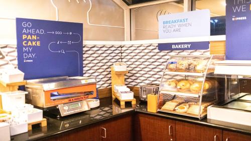 a bakery with a counter with pastries on it at Holiday Inn Express Berkeley by IHG in Berkeley