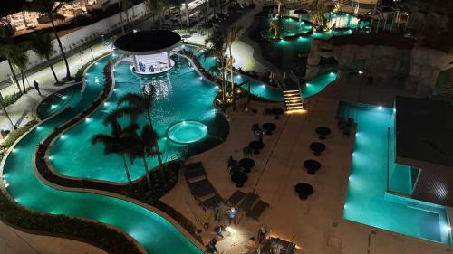 an overhead view of a swimming pool at night at Salinas Premium Resort - Quarto Linda Vista in Salinópolis