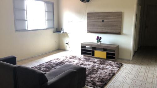 a living room with a couch and a table at Bela Vista in São Luís