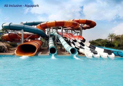 a water slide in a pool at a water park at Valeria Dar Atlas All Inclusive in Marrakesh