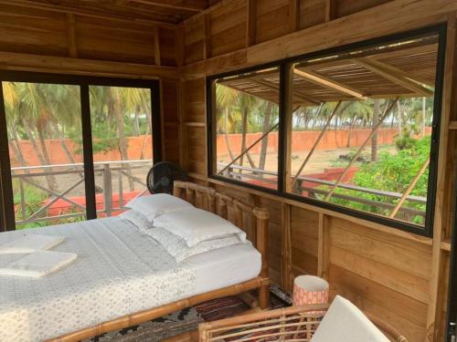 Voodi või voodid majutusasutuse Natura luxury camp toas