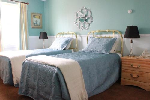 מיטה או מיטות בחדר ב-Garden South Park Inn