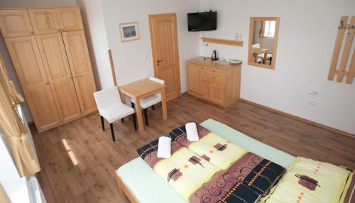 Cama o camas de una habitación en Penzion Prátr