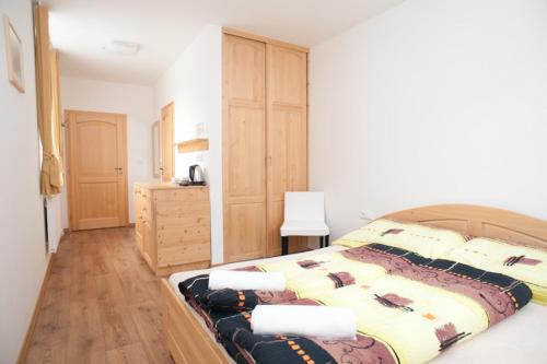 Cama o camas de una habitación en Penzion Prátr