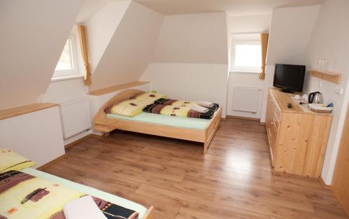Cama o camas de una habitación en Penzion Prátr
