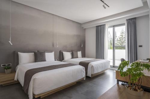 Postel nebo postele na pokoji v ubytování U+U Stay