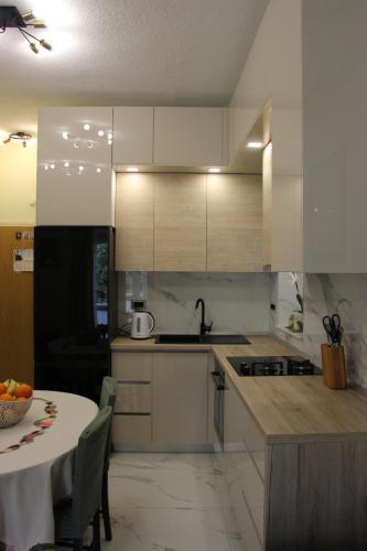 Dapur atau dapur kecil di Beachfront Apartment Deluxe