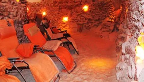 a group of chairs sitting in a stone room at bel-appartement-avec-terrasse in Bad Schwartau