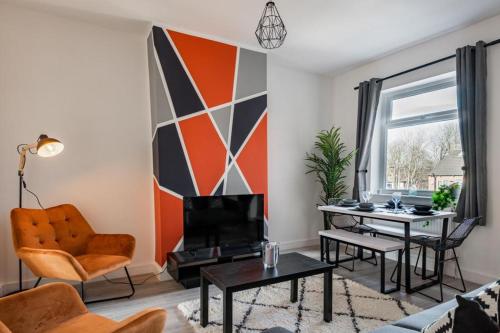 a living room with a couch and a table at Hopetown Apartment-modern 2 bed with free parking in Normanton