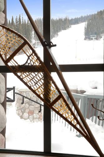 a view of a ski slope from a window at Sundance Lodge in Sun Peaks