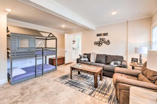 a living room with a couch and a bunk bed at New Bern Retreat with Fire Pit about 1 Mi to Dtwn! in New Bern