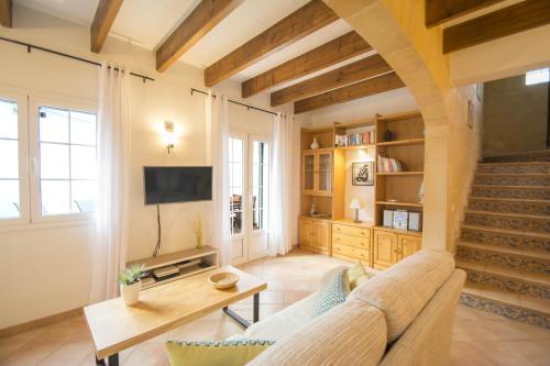 a living room with a couch and a table at Casa Maria by Sonne Villas in Ferreries