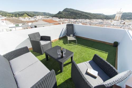 a balcony with a table and chairs on a roof at Casa Maria by Sonne Villas in Ferreries