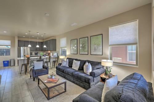 a living room with a couch and a table at Centrally Located Flagstaff Vacation Home with Patio in Flagstaff