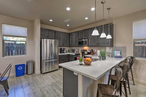 a kitchen with a large island in the middle of a room at Centrally Located Flagstaff Vacation Home with Patio in Flagstaff
