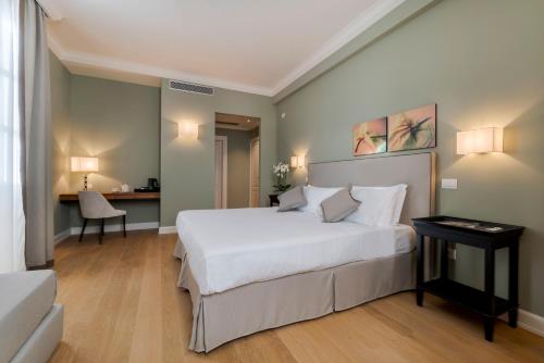 מיטה או מיטות בחדר ב-Villa Neroli