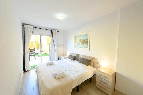 Postel nebo postele na pokoji v ubytování Terraza Los Cristianos
