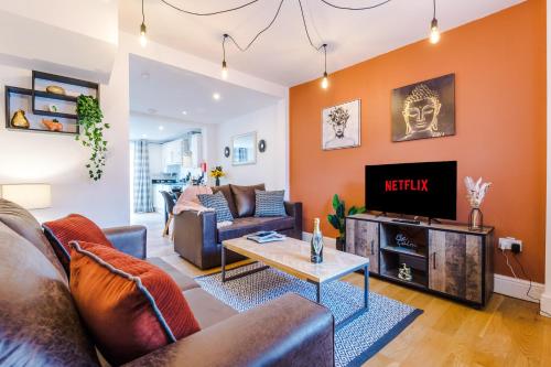 a living room with a couch and a tv at Pristine 2-bed house in Chester by 53 Degrees Property, ideal for Families & Small groups, Great Location - Sleeps 6 in Hough Green