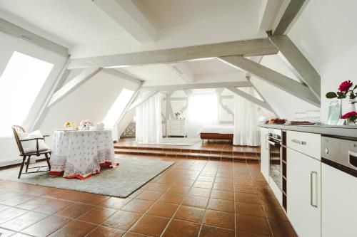 a kitchen with a table in the middle of a room at Krone Martinsthal in Eltville
