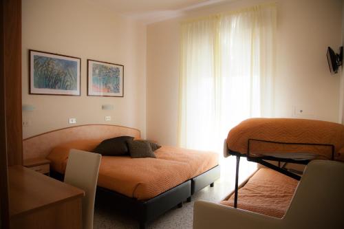 Ein Bett oder Betten in einem Zimmer der Unterkunft Riviera Mare Beach Life Hotel