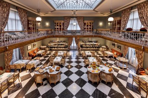 an overhead view of a restaurant with tables and chairs at Vidago Palace in Vidago