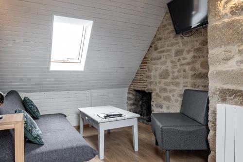 אזור ישיבה ב-joli appartement 2 pers dans les remparts de Guérande