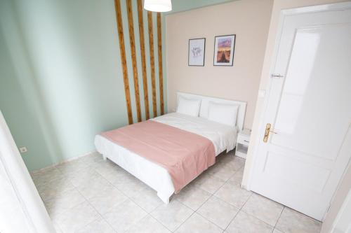 Postel nebo postele na pokoji v ubytování Vanilla Family house Preveza
