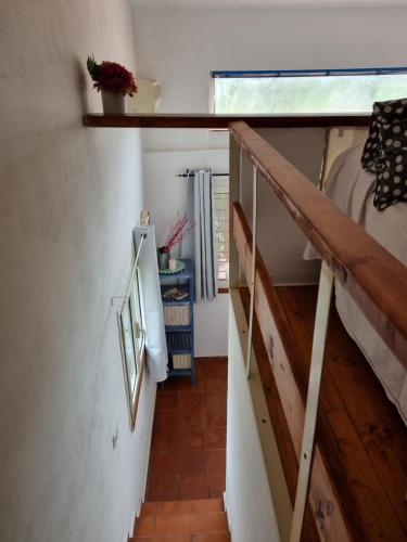 a room with a staircase with a bed and a window at Il Piccolo Borgo in Montalto di Castro