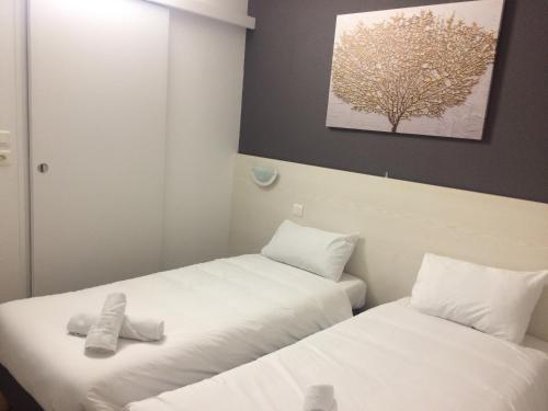 Katil atau katil-katil dalam bilik di Europe Hotel