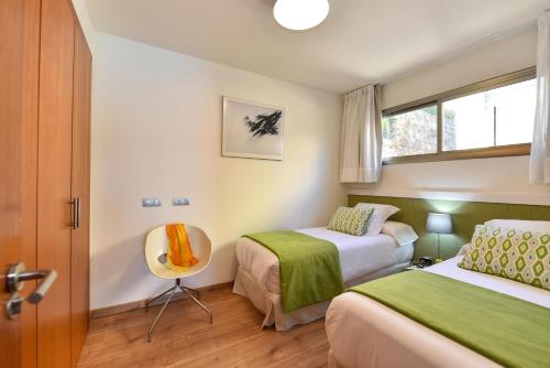 A bed or beds in a room at Par 4 Blue Star by VillaGranCanaria