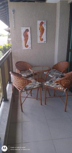 a balcony with a table and chairs on a porch at Portoparadise - Beach Class Eco life Residence in Porto De Galinhas